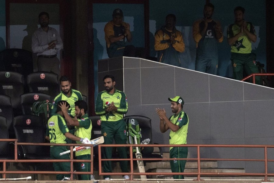 Pakistan's captain Babar Azam, left, celebrates with teammates after his dismissal for 122 runs during the fourth T20 cricket match between South Africa and Pakistan at Centurion Park in Pretoria, South Africa, Wednesday, on April 14, 2021 — AP photo