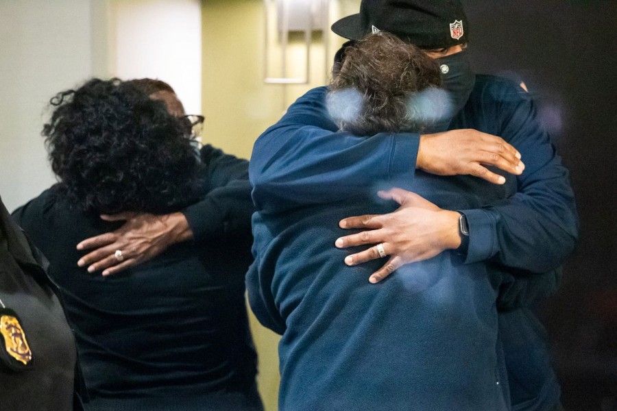 People embrace after learning that their loved one was safe after a mass casualty shooting at the FedEx facility in Indianapolis, Indiana, US, April 16, 2021. Mykal McEldowney/IndyStar/USA Today Network via REUTERS.