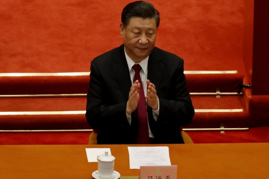 Chinese President Xi Jinping applauds at the closing session of the Chinese People's Political Consultative Conference (CPPCC) at the Great Hall of the People in Beijing, China, Mar 10, 2021 — Reuters/Files