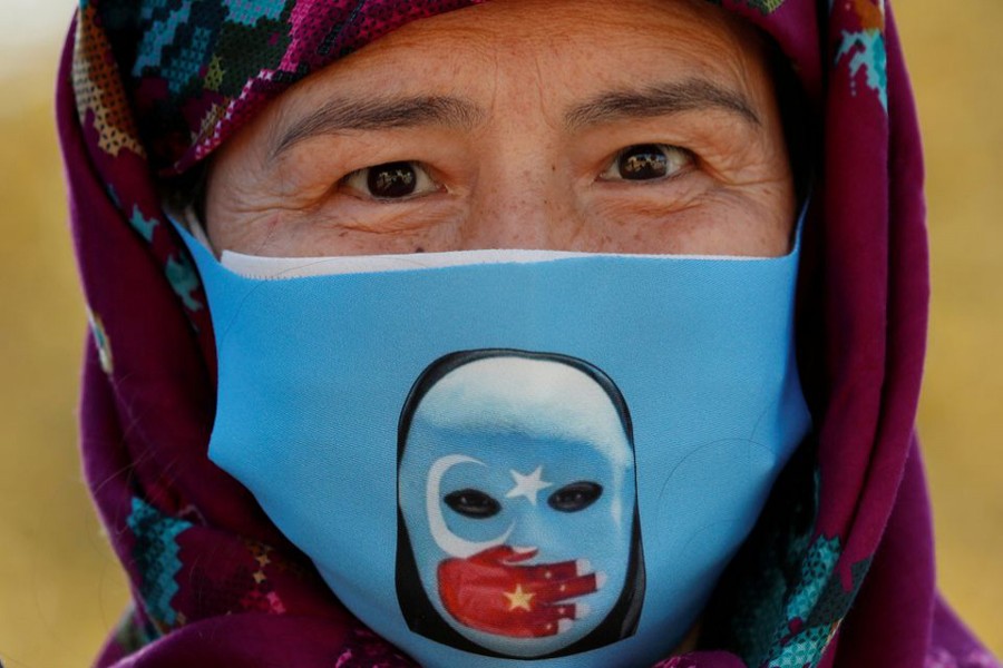 An Ethnic Uighur demonstrator wearing a protective face mask takes part in a protest against China, in Istanbul, Turkey on October 1, 2020 — Reuters/Files