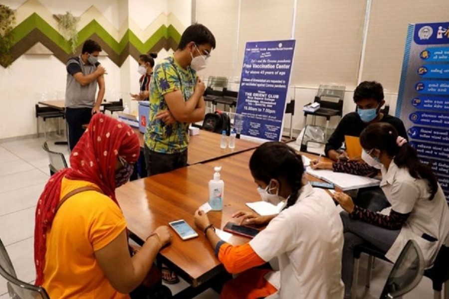 People get their names registered after receiving a dose of COVISHIELD, a coronavirus disease (COVID-19) vaccine manufactured by Serum Institute of India, at a vaccination centre in Ahmedabad, India, May 1, 2021. REUTERS