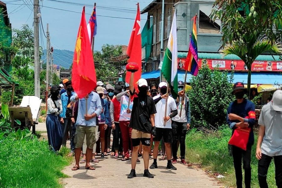 Demonstrators carry flags as they march to protest against the military coup, in Dawei, Myanmar, April 27, 2021 — Courtesy of Dawei Watch/via Reuters