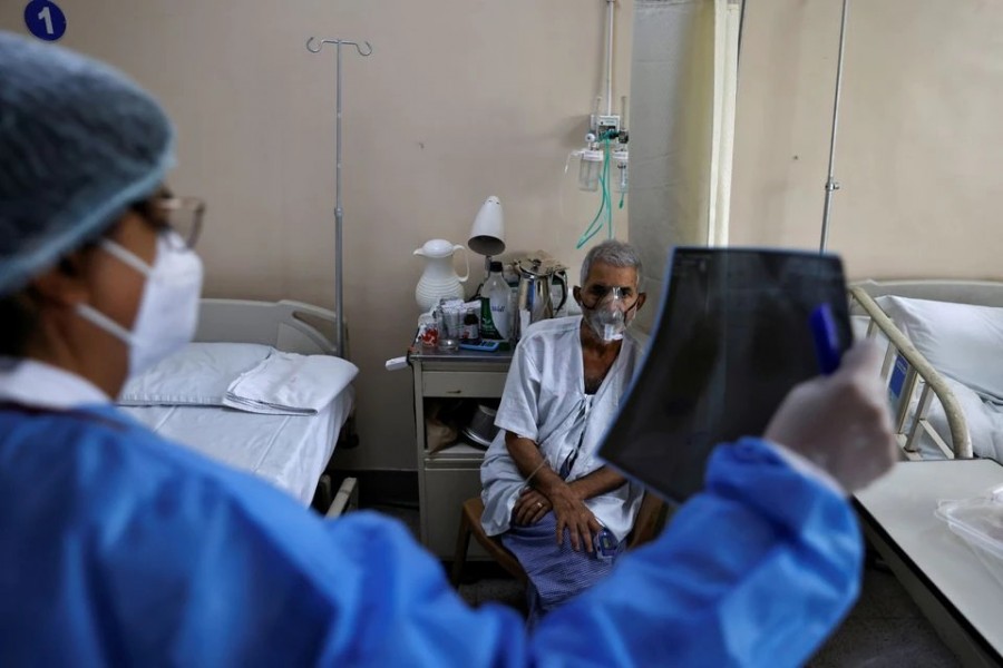 A doctor checks an X-ray of a patient suffering from the coronavirus disease (Covid-19) inside a Covid-19 ward of a hospital in New Delhi, India on May 1, 2021 — Reuters photo