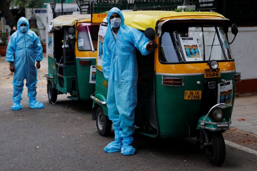 Drivers stand near auto rickshaw ambulances, prepared to transfer people suffering from the coronavirus disease (COVID-19) and their relatives for free, in New Delhi, India May 5, 2021. Picture taken May 5, 2021. REUTERS/Adnan Abidi