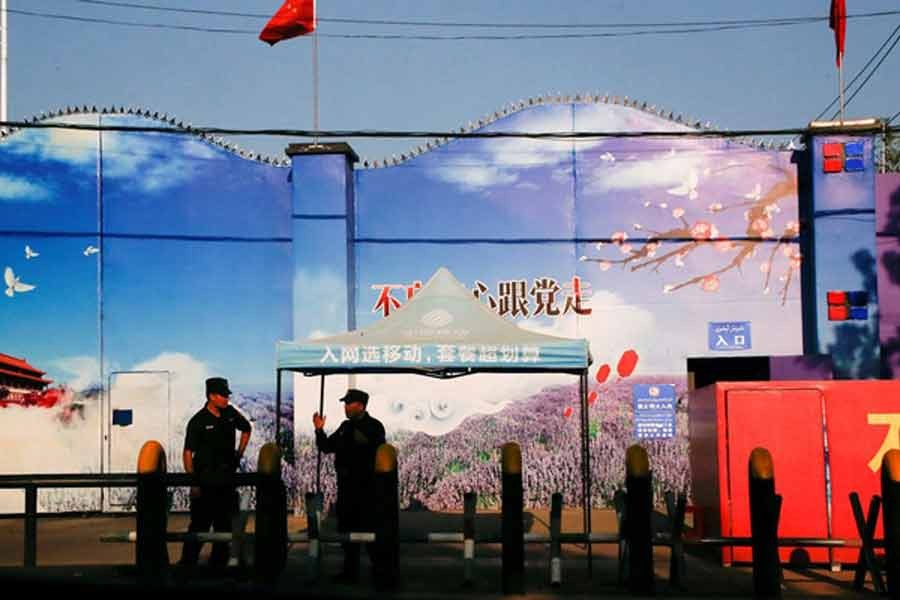 Security guards stand at the gates of what is officially known as a vocational skills education centre in Huocheng County in Xinjiang Uighur Autonomous Region in China -Reuters photo