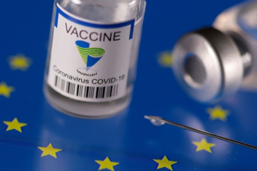 Vials labelled "Sinopharm coronavirus disease (COVID-19) vaccine" placed on displayed EU flag are seen in this illustration picture taken Mar 24, 2021. REUTERS