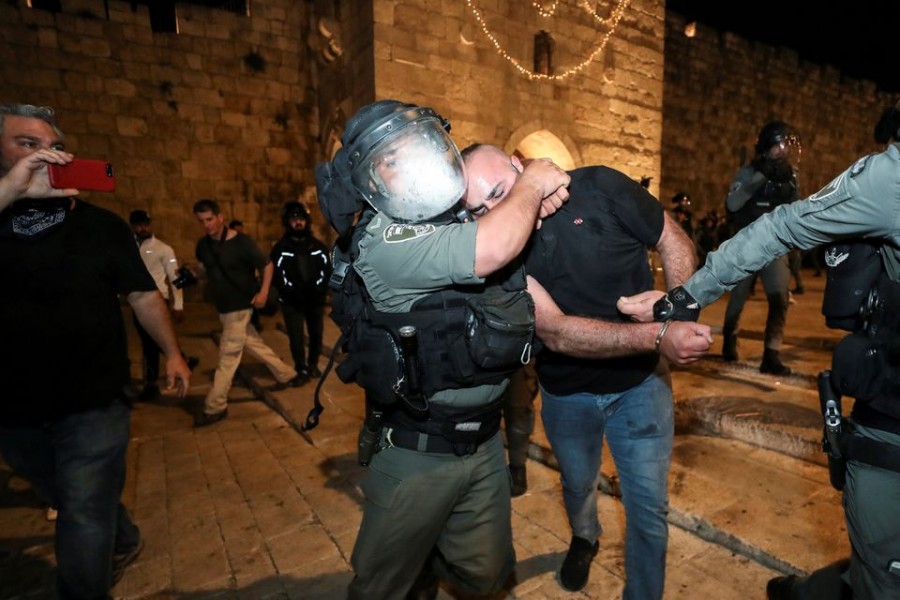 Israeli police detain a Palestinian at Jerusalem's Old City during clashes, as the Muslim holy fasting month of Ramadan continues, in Jerusalem April 24, 2021. REUTERS/ Ammar Awad