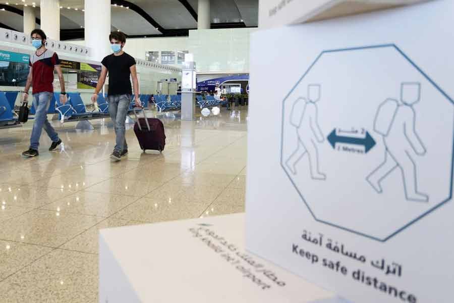 Travellers wearing protective face masks walk at Riyadh International Airport, after Saudi Arabia reopened domestic flights, following the outbreak of the coronavirus disease (COVID-19) last year -Reuters file photo