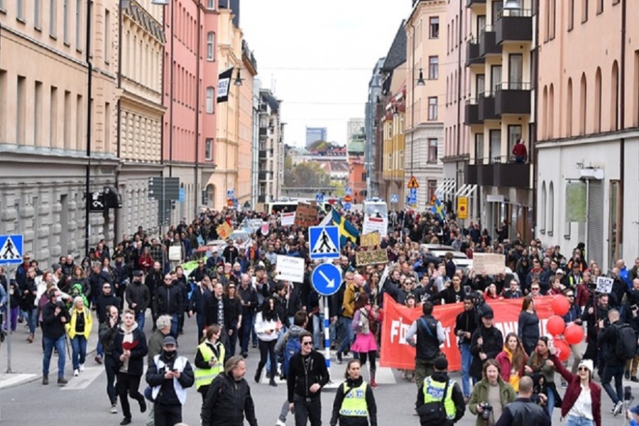 Protesters from Frihet Sverige (Freedom Sweden) march to protest against coronavirus disease (COVID-19) restrictions, in Stockholm, Sweden May 1, 2021. REUTERS
