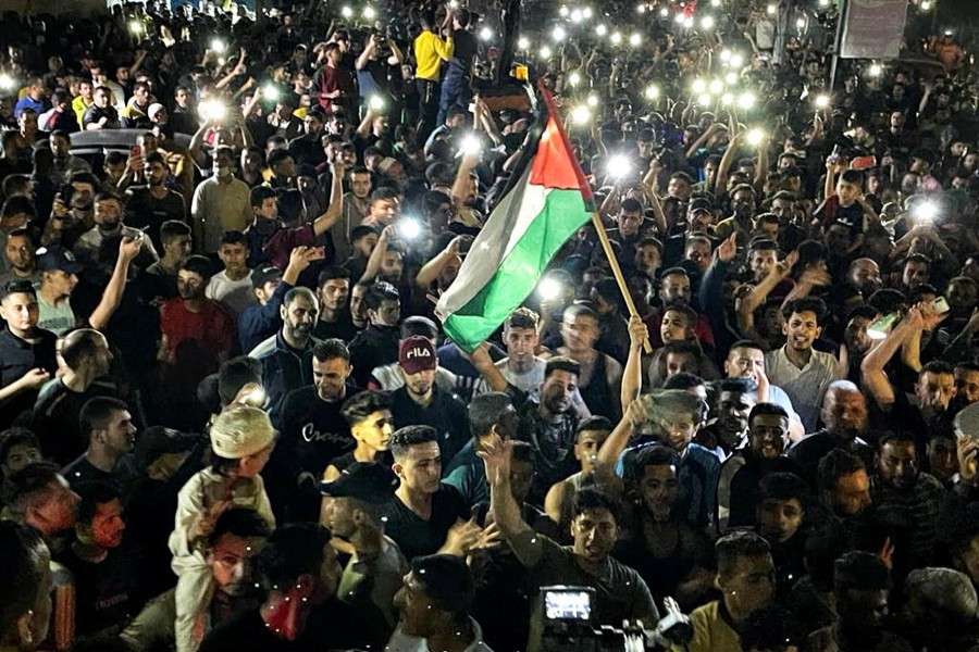 Palestinians celebrate in the streets following a ceasefire, in the southern Gaza Strip on May 21, 2021 — Reuters photo