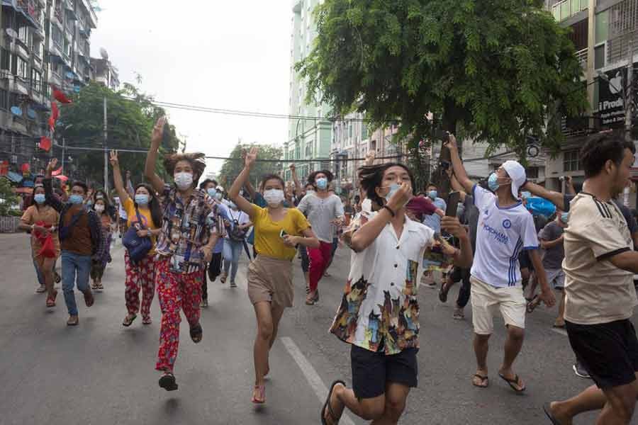 Anti-coup protesters showing the three-finger salute during a flash mob protest in Yangon of Myanmar on June 3 –Reuters file photo