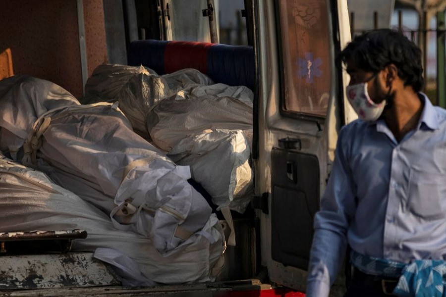 Dead bodies of people who died due to the coronavirus disease (Covid-19), are seen piled up in an ambulance before their cremation at a crematorium in New Delhi, India on June 3, 2020 — Reuters/Files