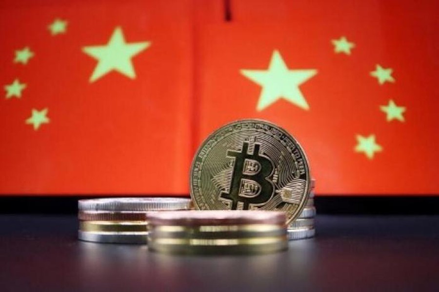 Representations of Bitcoin cryptocurrency are seen in front of an image of Chinese flags in this illustration picture taken on June 2, 2021 — Reuters/Files