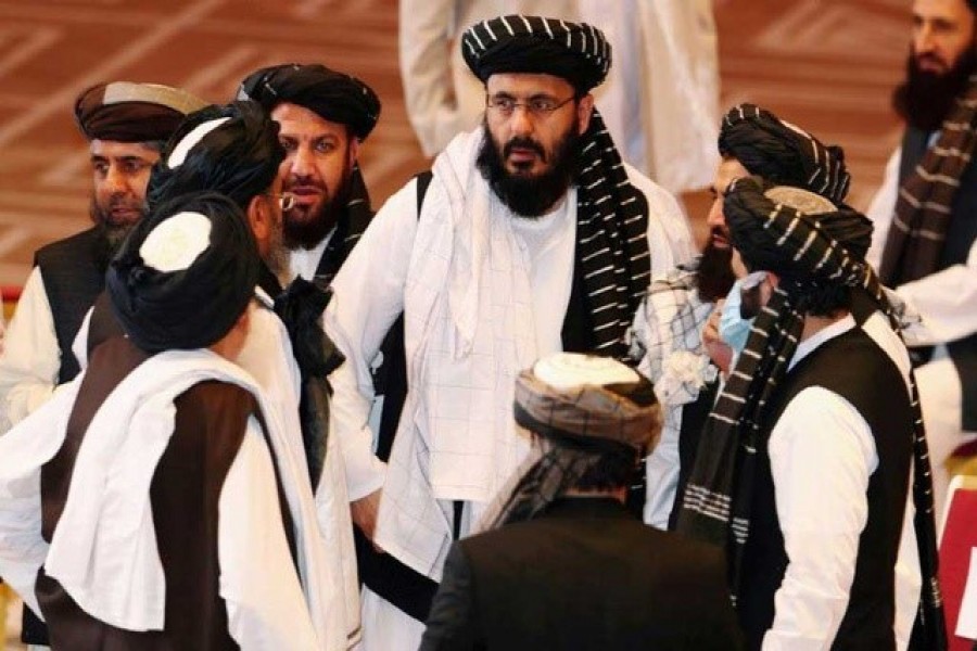 Taliban delegates speak during talks between the Afghan government and Taliban insurgents in Doha, Qatar, September 12, 2020 — Reuters/File Photo