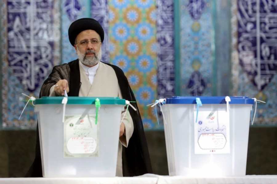 Iranian presidential candidate Ebrahim Raisi casts his vote during elections at a polling station in Tehran, Iran on June 18, 2021 — WANA via REUTERS