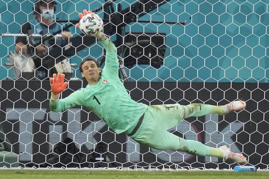 Switzerland's goalkeeper Yann Sommer saves the penalty shot by France's Kylian Mbappe during the Euro 2020 soccer championship round of 16 match between France and Switzerland at the National Arena stadium in Bucharest, Romania, Tuesday, June 29, 2021. (AP Photo/Vadim Ghirda, Pool)