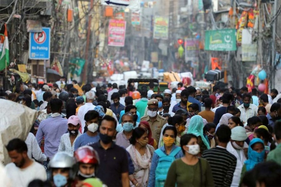 People are seen at a market amidst the spread of the coronavirus disease (COVID-19), in the old quarters of Delhi, October 19, 2020. REUTERS