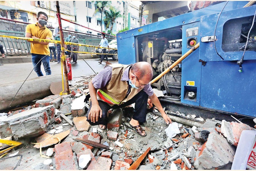 A Titas Gas staffer examining a gas supply line on Sunday morning at a site in the city's Moghbazar where a massive explosion took place last week. Later, a gas leakage was detected there — FE photo