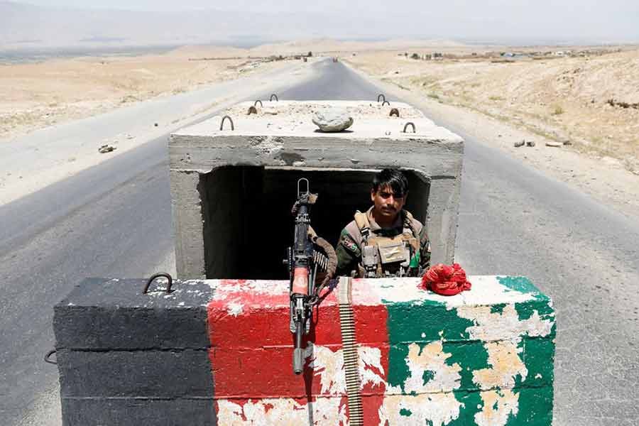 An Afghan National Army soldier standing guard at a checkpoint near Bagram US airbase, on the day the last of American troops vacated it, Parwan province, Afghanistan on July 2 -Reuters photo