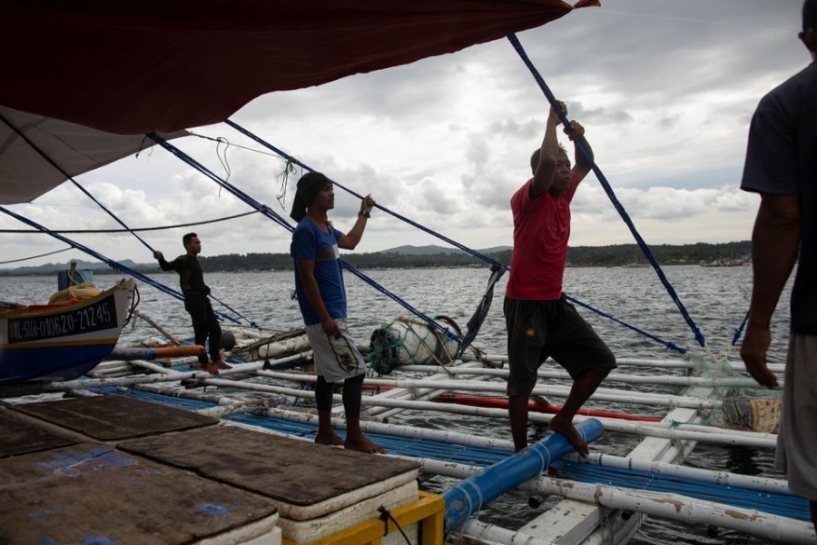 Filipino fishermen rest after arriving from a week-long trip to the disputed Scarborough Shoal, in Infanta, Pangasinan province, Philippines on July 6, 2021 — Reuters photo