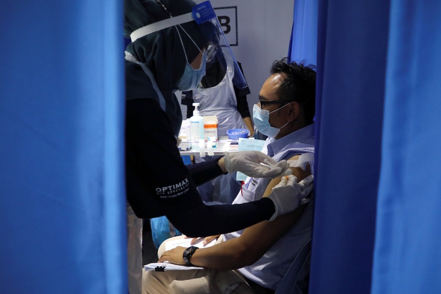 A construction worker receives a dose of the Sinovac vaccine against the coronavirus disease (COVID-19), in a vaccination truck in Kuala Lumpur, Malaysia on June 8, 2021 — Reuters/Files