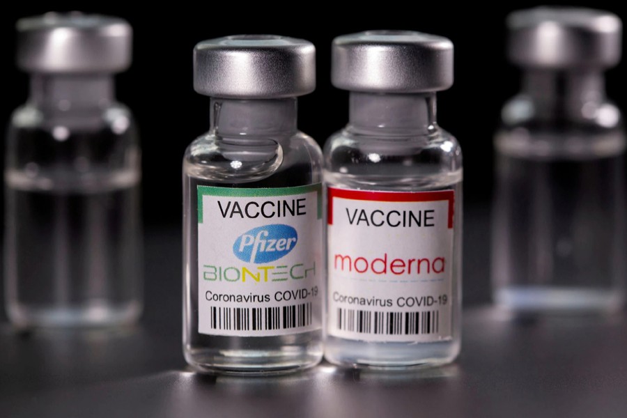 Vials with Pfizer-BioNTech and Moderna coronavirus disease (Covid-19) vaccine labels are seen in this illustration picture taken on March 19, 2021 — Reuters/Files