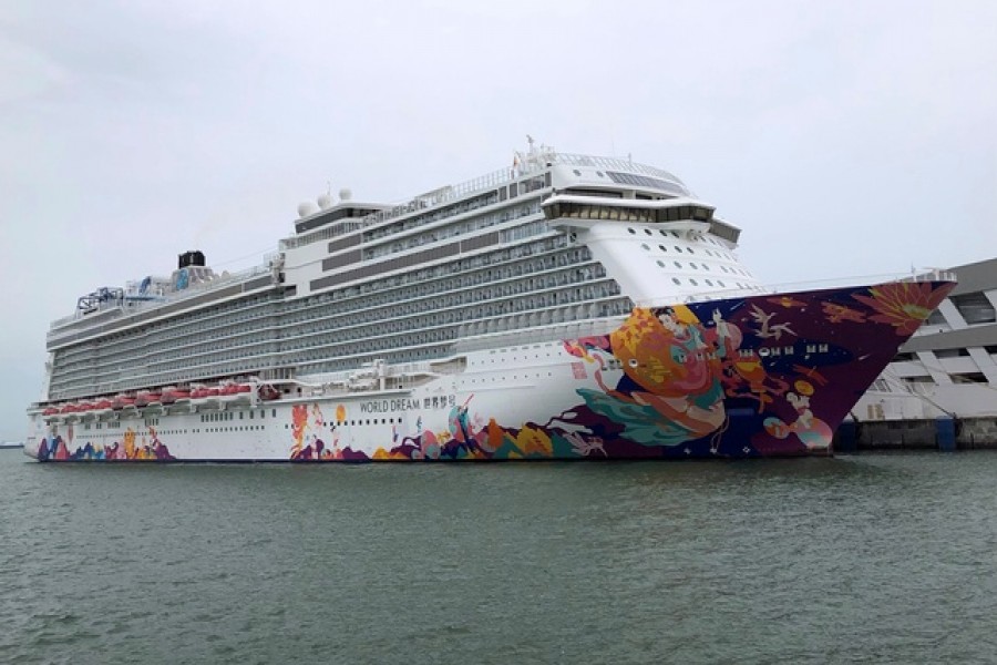 A cruise ship is docked at harbour after turning back due to positive coronavirus disease (COVID-19) case on board, in Singapore Jul 14, 2021. REUTERS