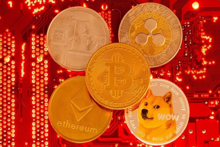 Representations of cryptocurrencies Bitcoin, Ethereum, DogeCoin, Ripple, Litecoin are placed on PC motherboard in this illustration taken, June 29, 2021. REUTERS/Dado Ruvic/Illustration