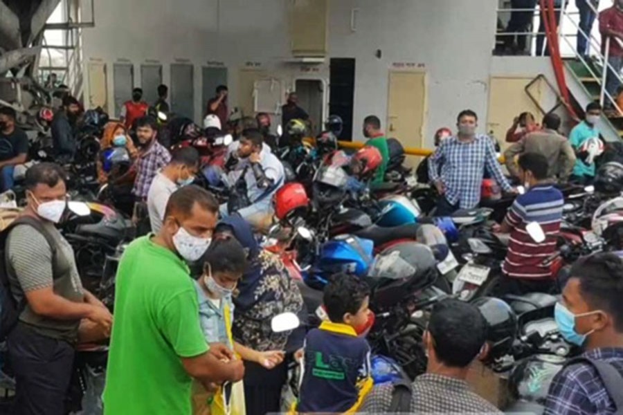 Homebound people crowd Shimulia ferry terminal