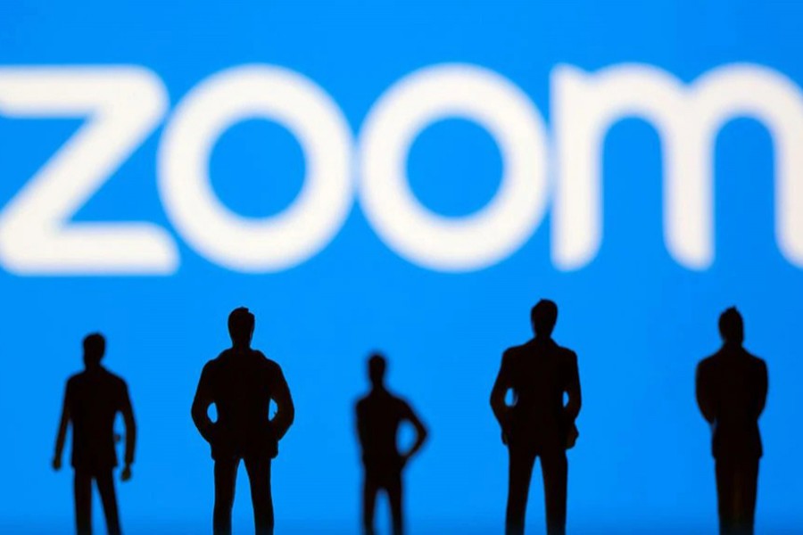 Small toy figures are seen in front of Zoom logo in this illustration picture taken on March 15, 2021 — Reuters/Files