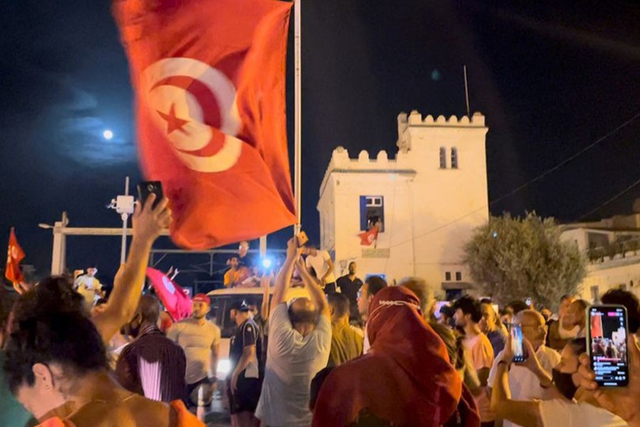 Crowds gather on the street after Tunisia's president suspended parliament, in La Marsa, near Tunis, Tunisia on July 26, 2021, in this still image obtained from a social media video — Layli Foroudi via REUTERS