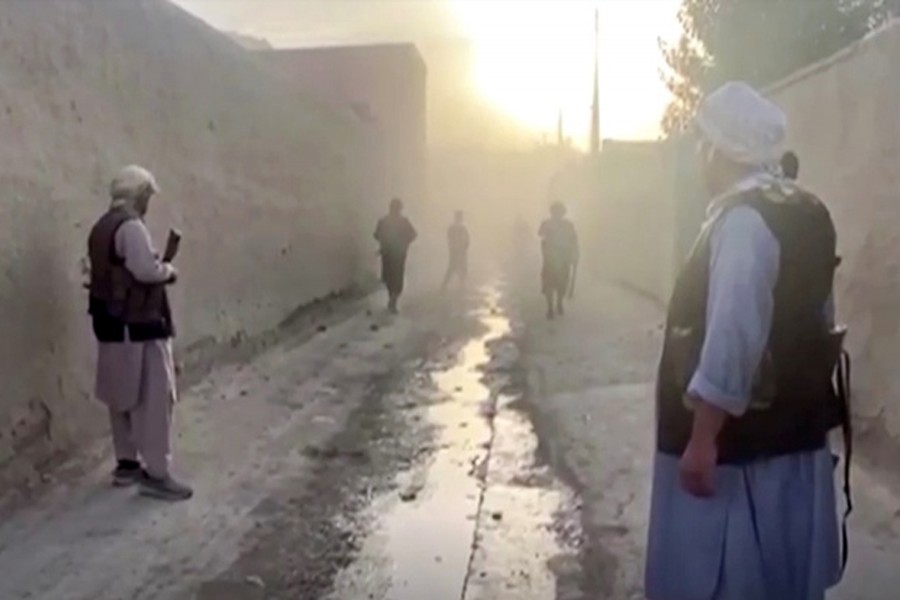 Smoke hovers at the site of an explosion as Afghan forces clash with Taliban fighters near Kunduz, Afghanistan on July 10, 2021, in this picture obtained by Reuters from a video