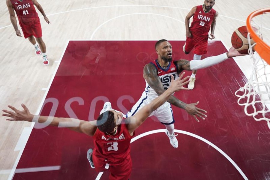 United States' Damian Lillard (6) shoots over Iran's Mohammadsina Vahedi (3) during a men's basketball preliminary round game at the 2020 Summer Olympics, Wednesday, July 28, 2021, in Saitama, Japan — AP Photo