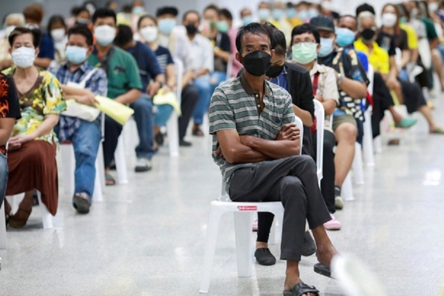 People queue at the Central Vaccination Center as Thailand begins offering first doses of the AstraZeneca vaccine to at-risk groups amid the coronavirus (COVID-19) outbreak in Bangkok, Thailand, July 26, 2021.