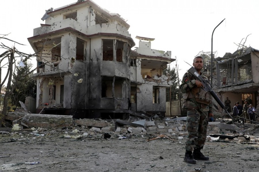 An Afghan National Army (ANA) soldier keeps watch at the site of yesterday's night-time car bomb blast in Kabul, Afghanistan August 4, 2021. REUTERS