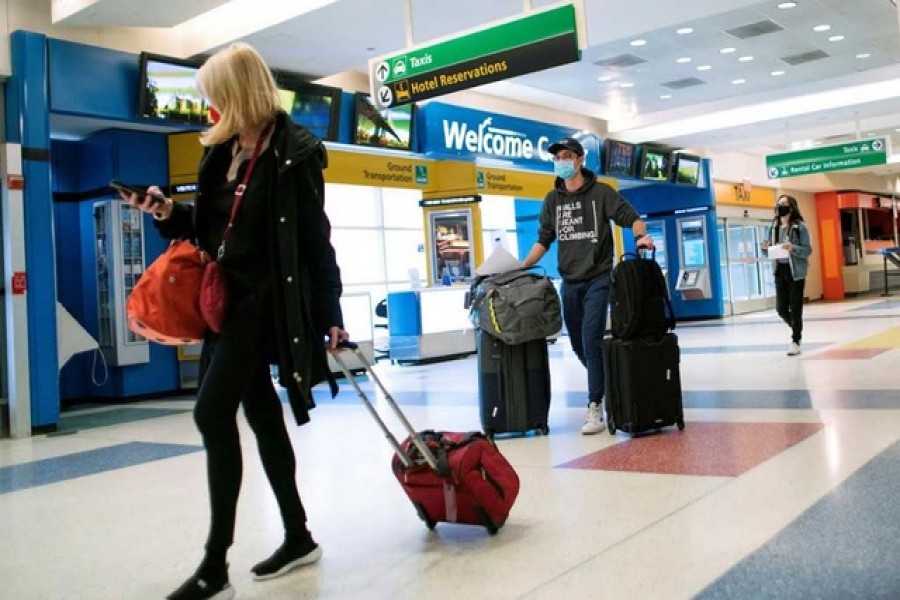 Passengers arrive on a flight from London amid new restrictions to prevent the spread of coronavirus disease (COVID-19) at JFK International Airport in New York City, US, December 21, 2020 — Reuters