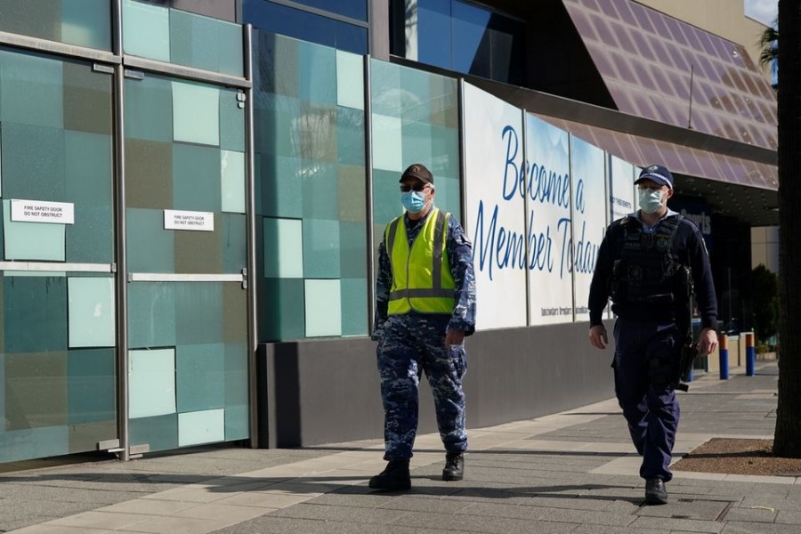 Personnel from the Australian Defence Force and New South Wales Police Force patrol a street in the Bankstown suburb during an extended lockdown to curb the spread of the coronavirus disease (Covid-19) in Sydney, Australia on August 3, 2021 — Reuters photo