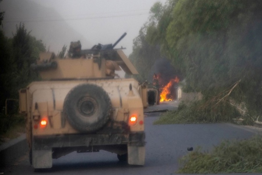 Humvees that belong to Afghan Special Forces are seen destroyed during heavy clashes with Taliban during the rescue mission of a police officer besieged at a check post, in Kandahar province, Afghanistan, July 13, 2021. Reuters