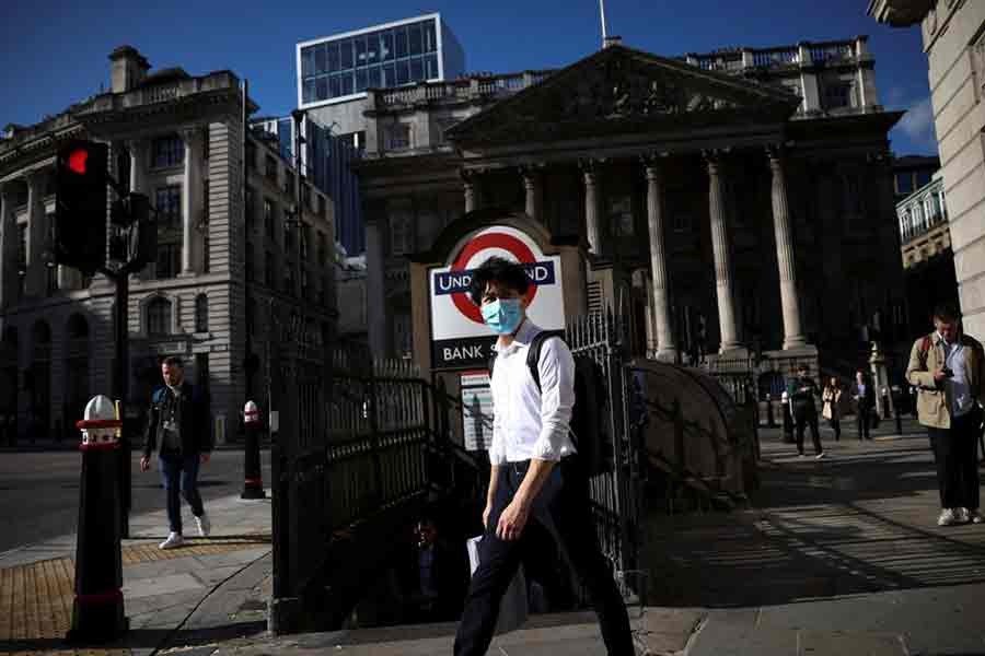 A person walking past Bank underground station during morning rush hour, amid the coronavirus disease (COVID-19) pandemic in London on July 29 this year -Reuters file photo