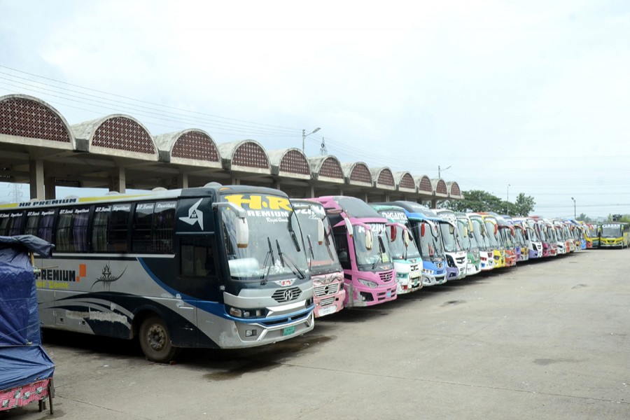 Buses sit idle at Gabtoli Bus Terminal amid a government-imposed lockdown to curb the spread of Covid-19 in Dhaka