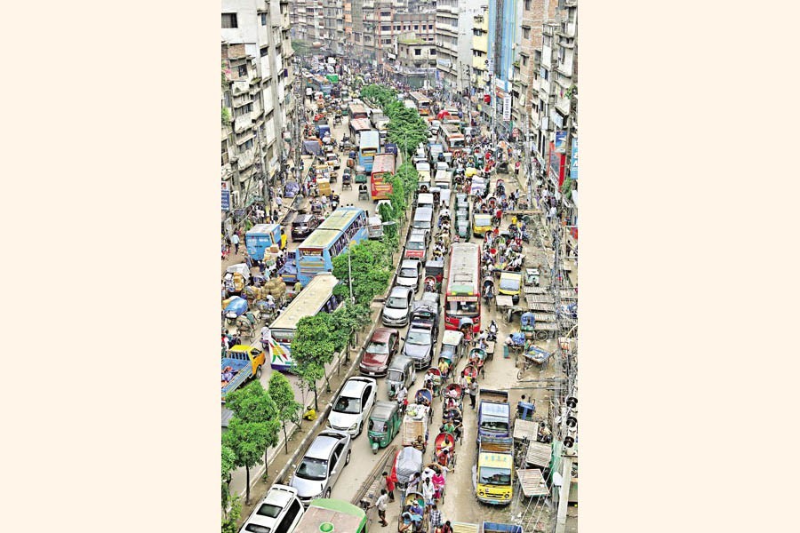 Dhaka returns to normal with crowd and traffic occupying the streets again, as the government eased Covid-induced restrictions. The photo was taken from North South Road in Old Dhaka on Wednesday — FE photo by Shafiqul Alam