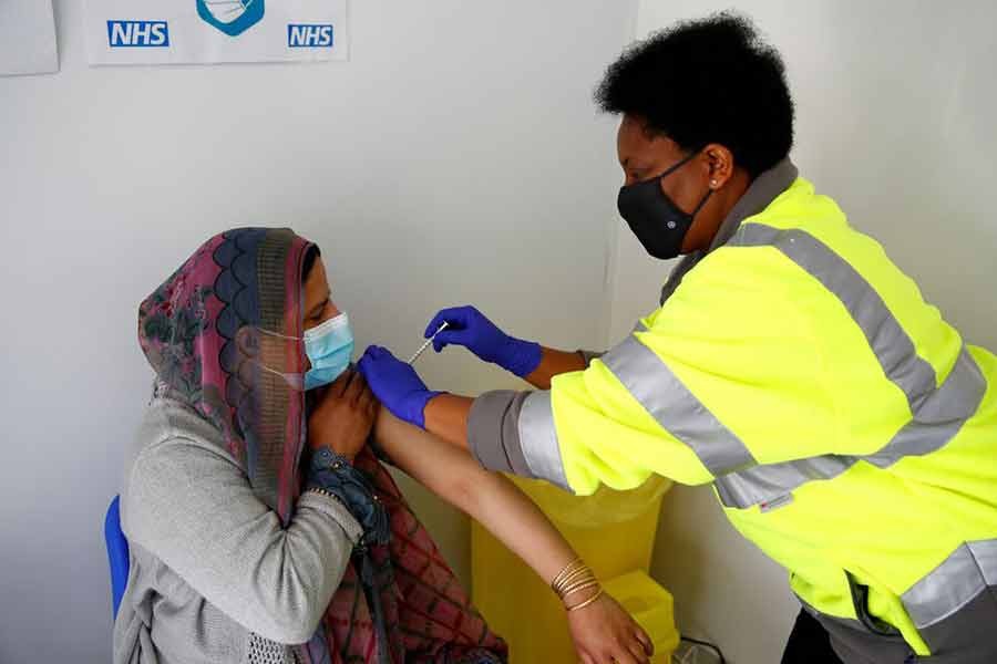 A woman receiving a dose of Pfizer vaccine against COVID-19 at a vaccination centre in Blackburn of Britain on May 19 this year -Reuters file photo