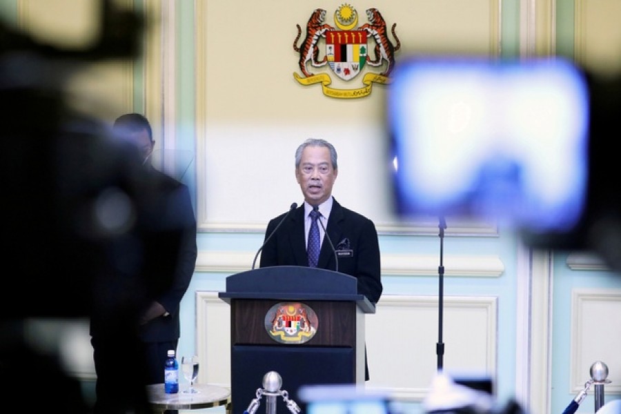 FILE PHOTO: Malaysia's Prime Minister Muhyiddin Yassin speaking during his cabinet announcement in Putrajaya, Malaysia March 9, 2020. REUTERS