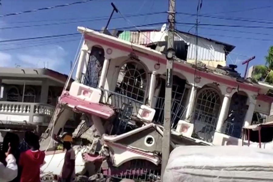 A view of a collapsed building following an earthquake, in Les Cayes, Haiti, in this still image taken from a video obtained by Reuters on August 14, 2021 — Reuters TV via Reuters