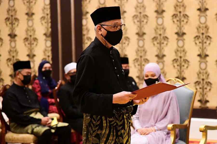 Malaysia's new Prime Minister Ismail Sabri Yaakob taking the oath of office during his inauguration at National Palace in Kuala Lumpur on Saturday -Reuters photo