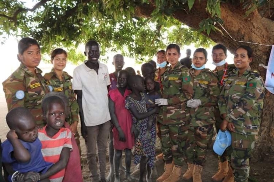 Bangladesh Army's Female Engagement Team (FET) members with locals in Sudan during a UN peace mission - Collected