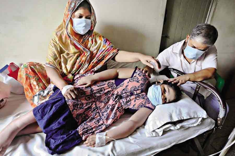 These three members of a family have got admitted to a private hospital in Motijheel area with dengue fever. Bangladesh sees a sharp rise in the number of dengue cases these days amid Covid crisis. The photo was taken last week. — FE file photo