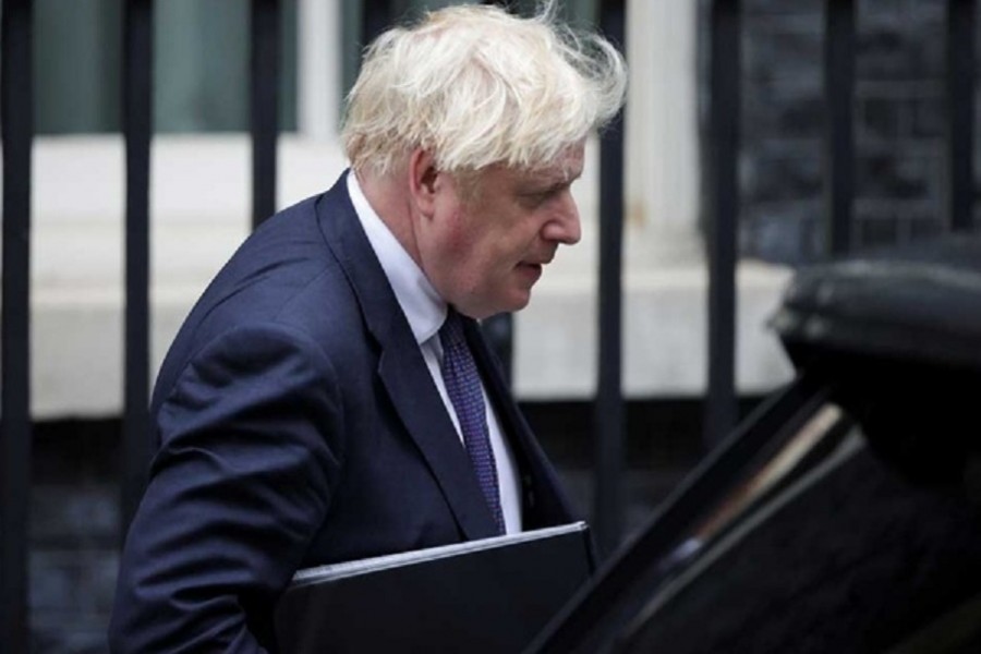 Britain's Prime Minister Boris Johnson walks outside Downing Street in London, Britain, August 18, 2021. REUTERS/Hannah McKay