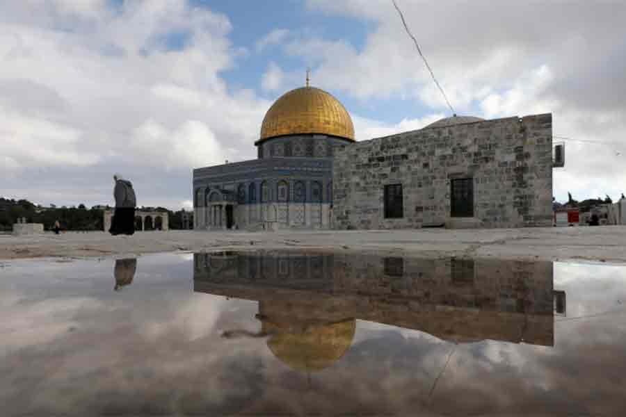 The Al-Aqsa mosque reflecting in a puddle next to a gate to the compound known to Jews as Temple Mount and to Muslims as The Noble Sanctuary, in Jerusalem's Old City -Reuters file photo