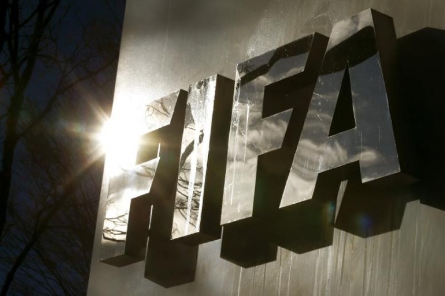 The sun is reflected in FIFA's logo in front of FIFA's headquarters in Zurich, Switzerland on November 19, 2015 — Reuters/Files